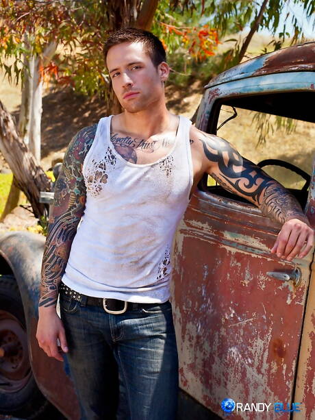 American beefcake Jordan Levine teasing his dick outside