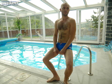 Czech mature bear Donnie Marco posing naked at the pool